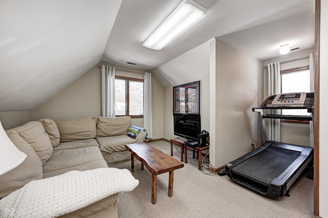 carpeted living room with lofted ceiling