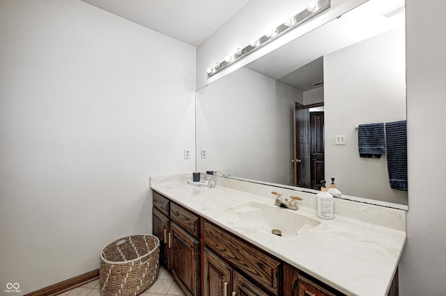 bathroom featuring tile patterned flooring and vanity