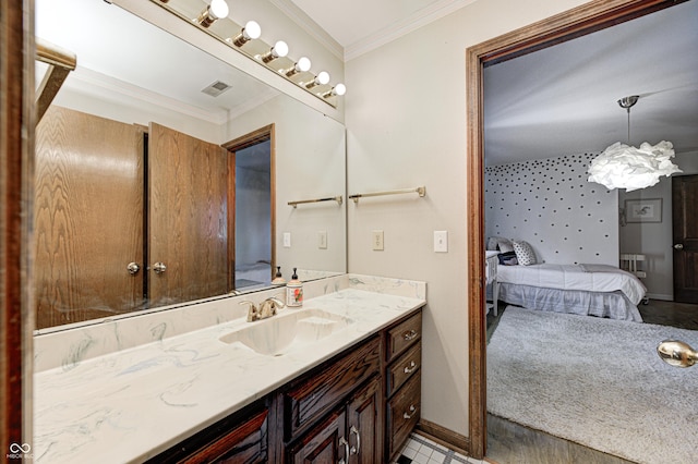 bathroom featuring vanity and ornamental molding