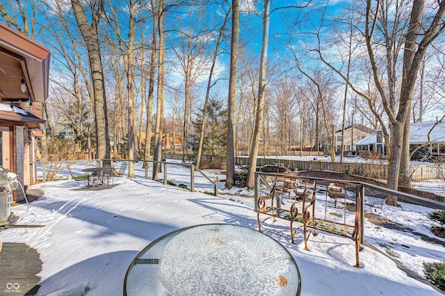 view of yard layered in snow