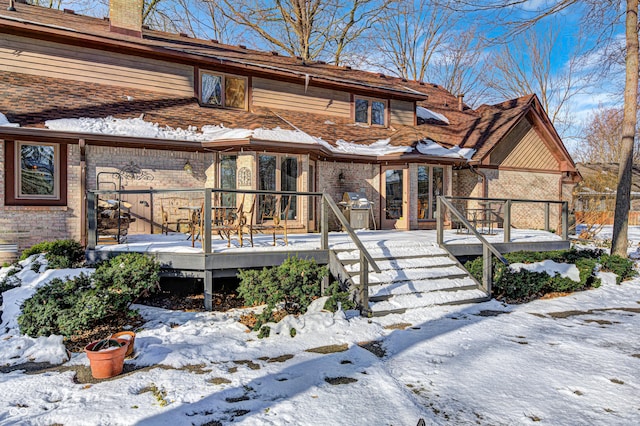 view of front facade with a wooden deck