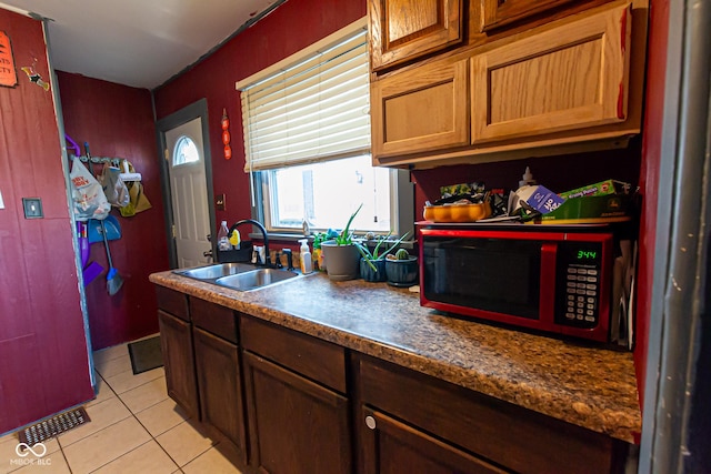 kitchen with sink and light tile patterned floors