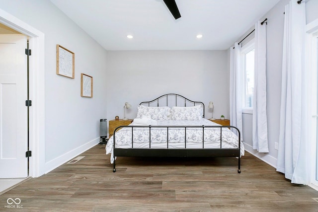 bedroom featuring ceiling fan and hardwood / wood-style flooring