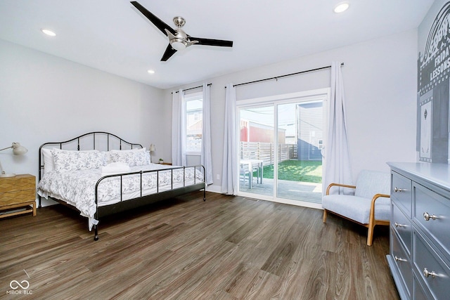 bedroom with access to exterior, ceiling fan, and dark wood-type flooring