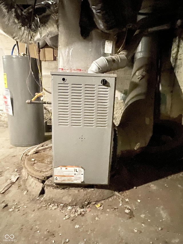 utility room featuring water heater