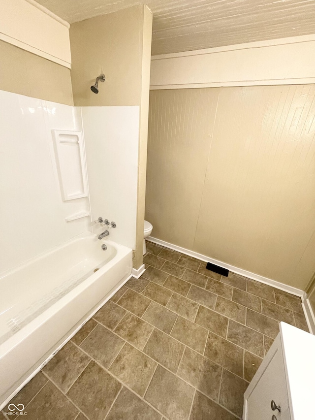 full bathroom with bathtub / shower combination, vanity, and toilet