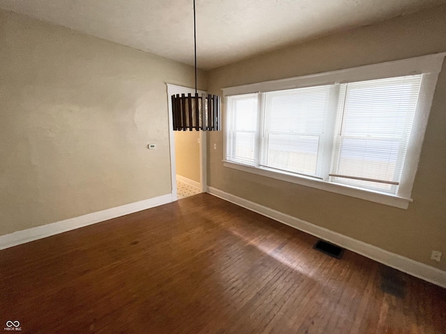 unfurnished dining area with hardwood / wood-style flooring