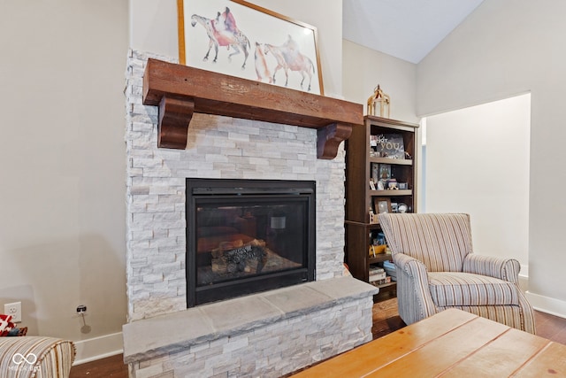 living room featuring dark hardwood / wood-style flooring and lofted ceiling