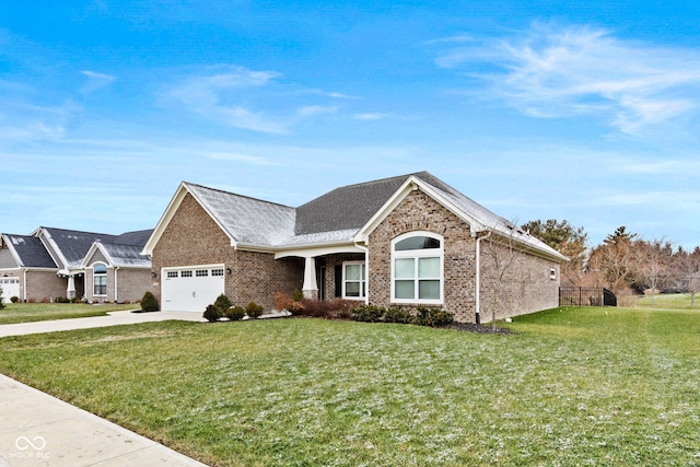 view of front of property featuring a garage and a front yard