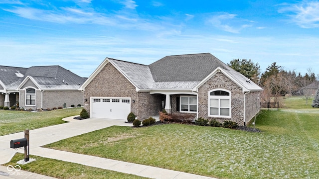 view of front facade with a front yard and a garage