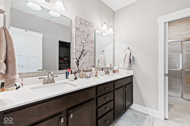 bathroom with vanity and an enclosed shower