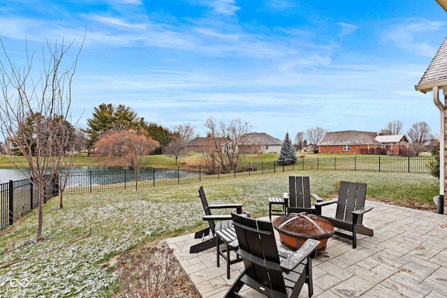 view of patio / terrace featuring a fire pit and a water view