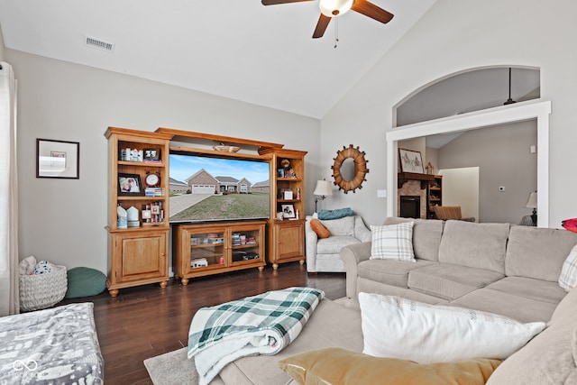 living room with dark hardwood / wood-style floors, ceiling fan, and lofted ceiling