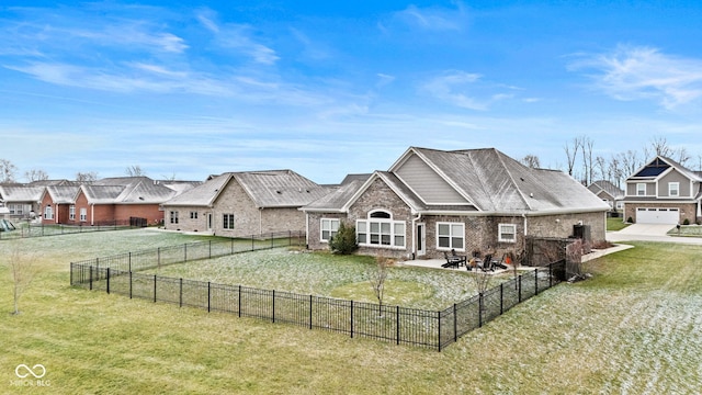 rear view of property featuring a yard and a patio