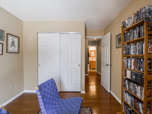 sitting room featuring dark hardwood / wood-style flooring