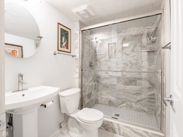 full bathroom featuring visible vents, toilet, a stall shower, marble finish floor, and a textured ceiling