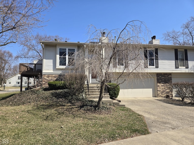 view of front of property featuring an attached garage, brick siding, driveway, and a chimney