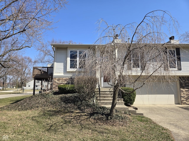 view of front of home featuring brick siding, an attached garage, driveway, and entry steps