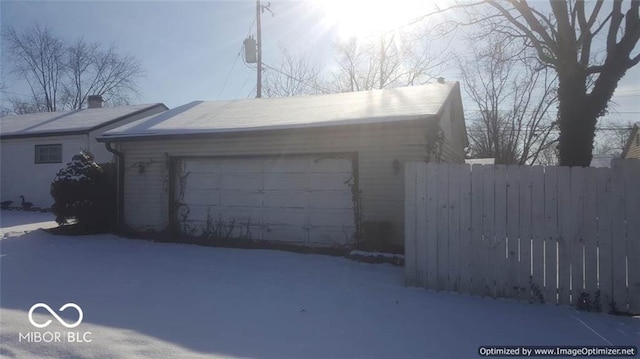 view of snow covered garage