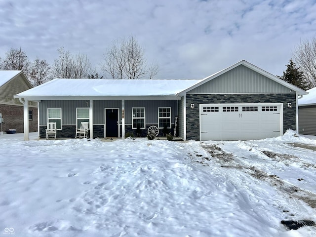 view of front of home with covered porch and a garage