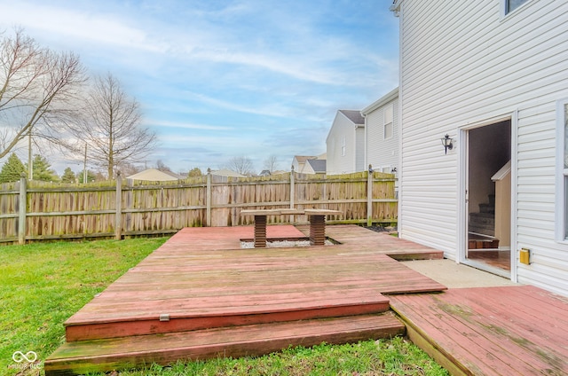 wooden deck with a lawn