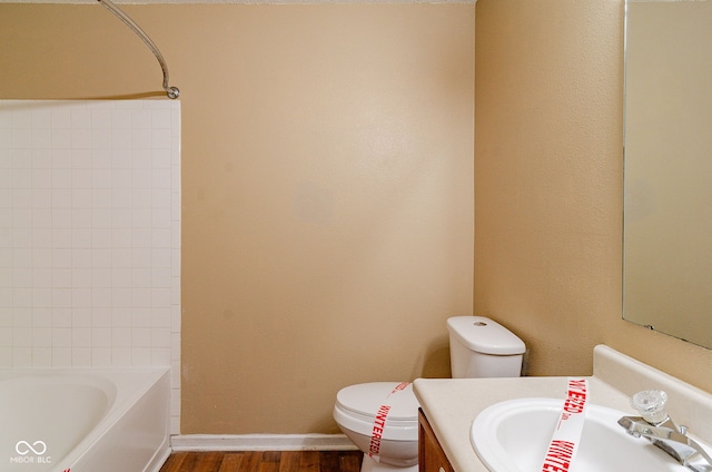 full bathroom featuring toilet, vanity, shower / washtub combination, and hardwood / wood-style floors