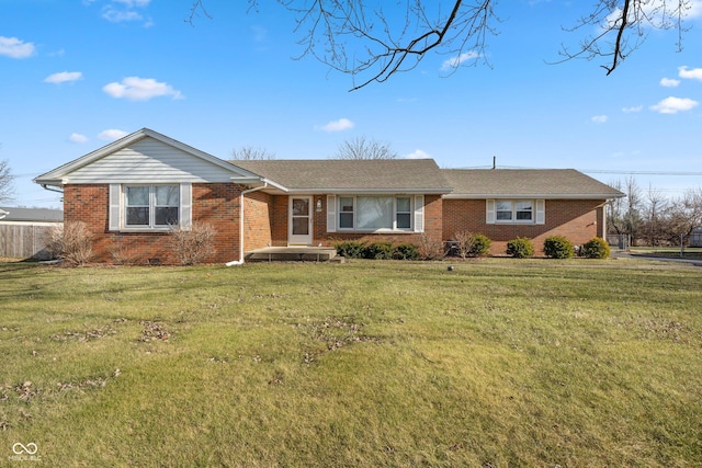 ranch-style home featuring a front lawn