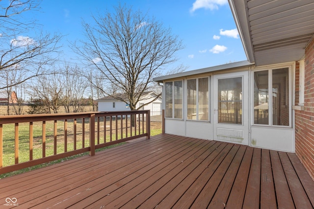 wooden terrace featuring a sunroom