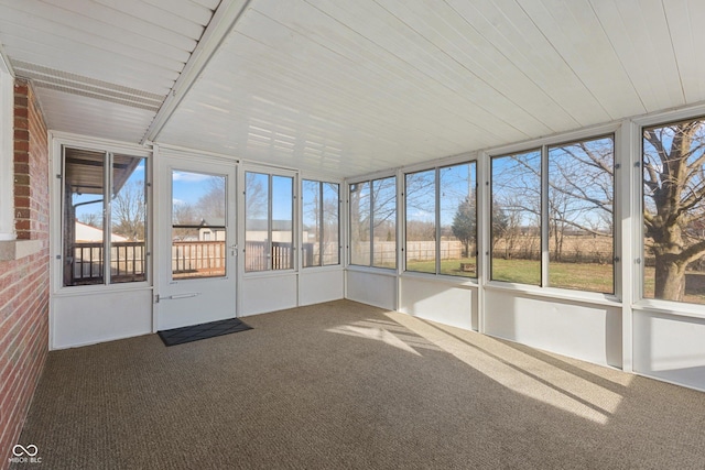 unfurnished sunroom with plenty of natural light