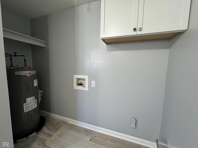 laundry area featuring cabinets, washer hookup, electric water heater, a textured ceiling, and light hardwood / wood-style floors