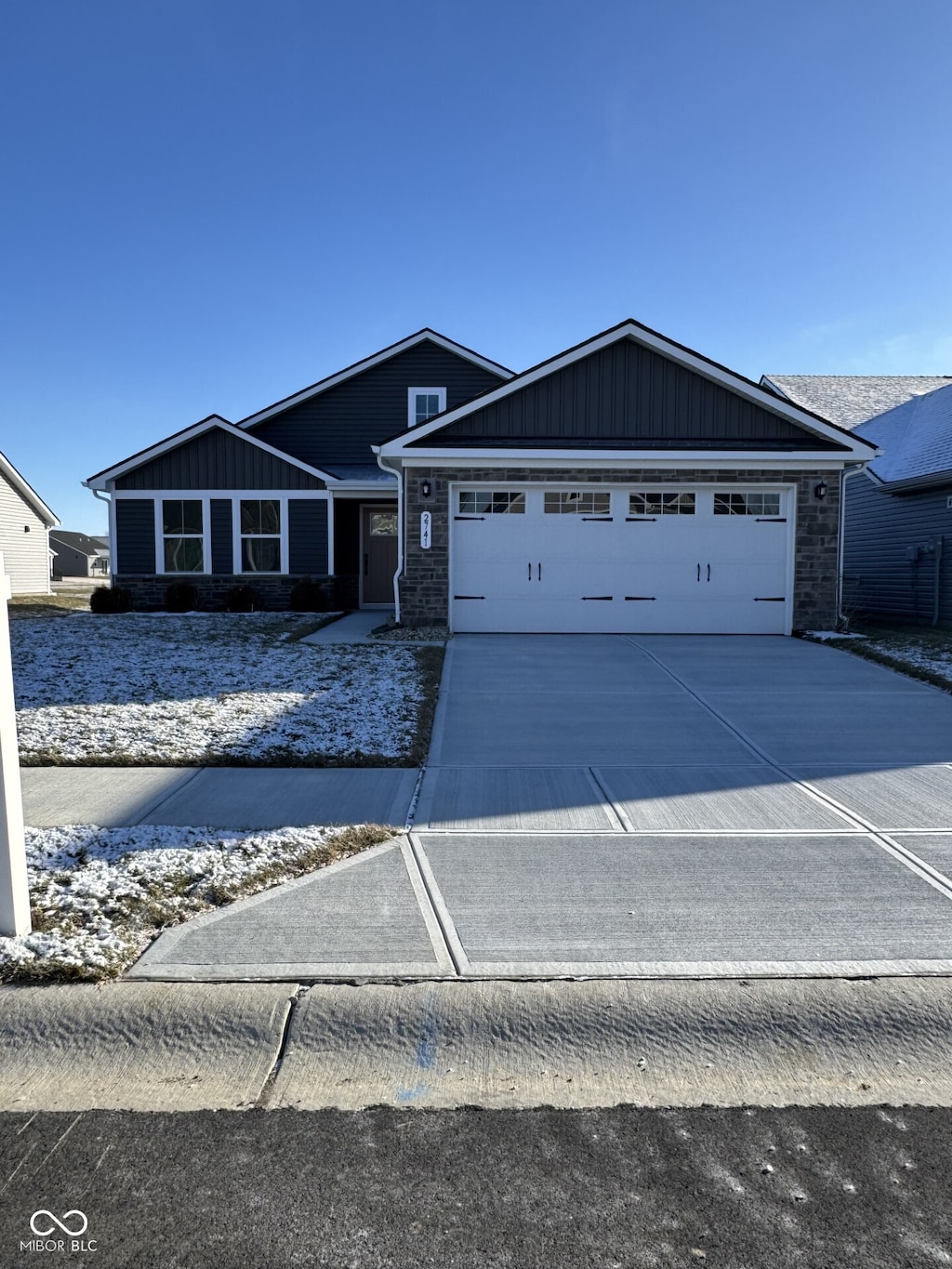 single story home with a garage