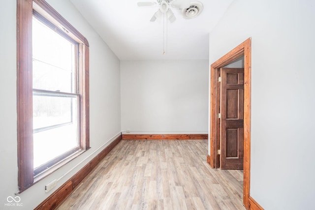 additional living space with ceiling fan and light hardwood / wood-style floors