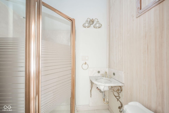 bathroom with wood walls