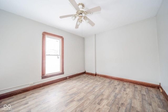 empty room featuring light hardwood / wood-style floors and ceiling fan