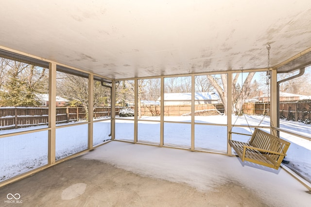 unfurnished sunroom with a wealth of natural light