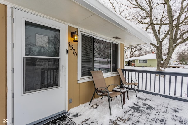 view of snow covered deck