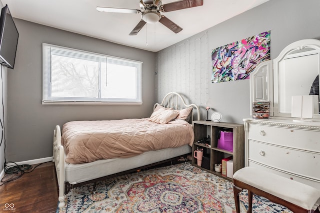 bedroom with ceiling fan and dark hardwood / wood-style floors