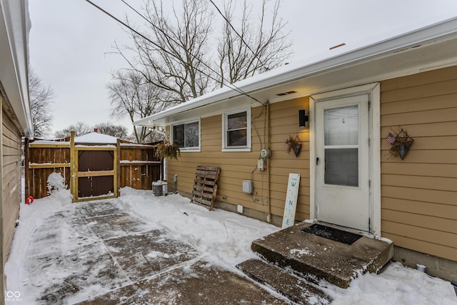 view of snow covered property entrance