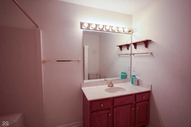 bathroom with vanity and toilet