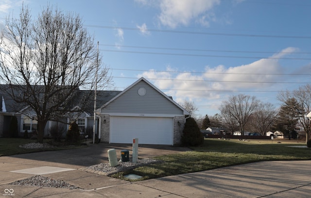 view of property exterior with a garage and a lawn