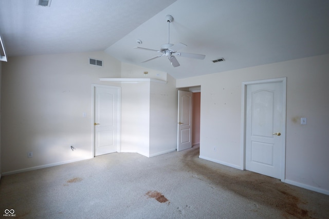 unfurnished bedroom featuring light colored carpet, ceiling fan, and lofted ceiling