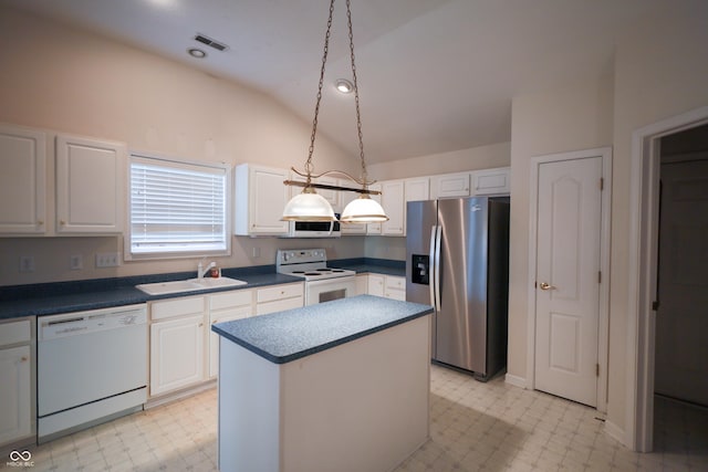 kitchen with white appliances, a kitchen island, sink, white cabinetry, and lofted ceiling