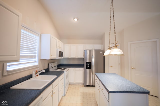 kitchen featuring a center island, white appliances, sink, vaulted ceiling, and white cabinetry