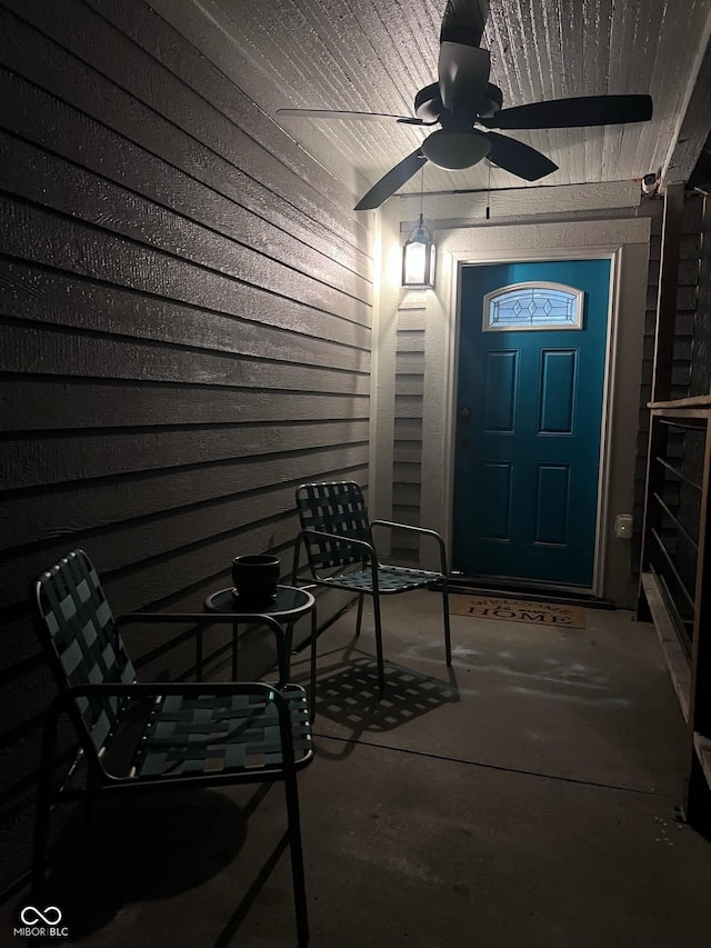 entrance to property with ceiling fan