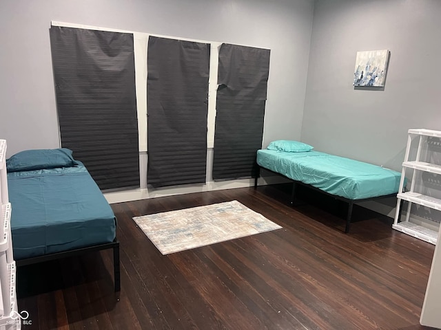 bedroom featuring dark hardwood / wood-style flooring