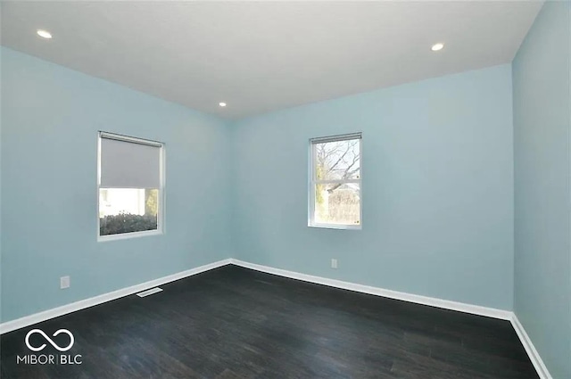 empty room featuring hardwood / wood-style floors