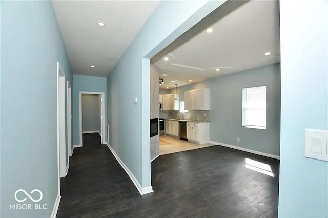 hallway featuring dark hardwood / wood-style floors