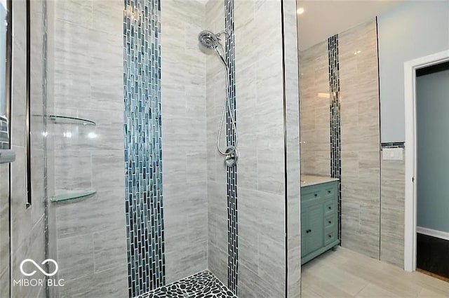 bathroom featuring tile walls and tiled shower