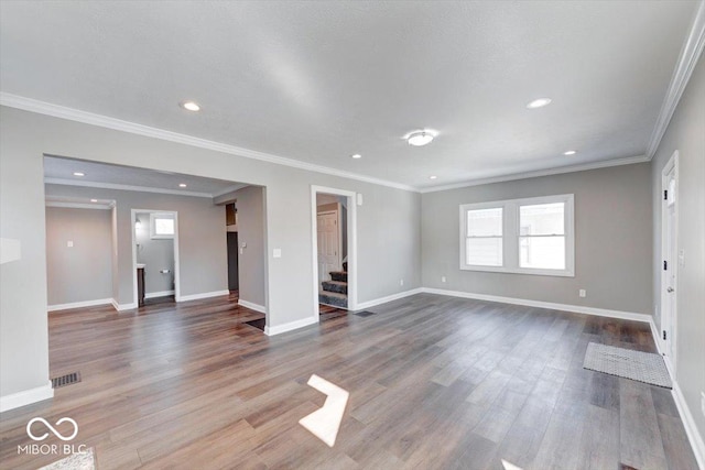 unfurnished living room featuring baseboards, visible vents, wood finished floors, and recessed lighting