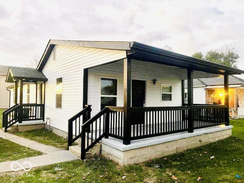 view of property exterior with a porch